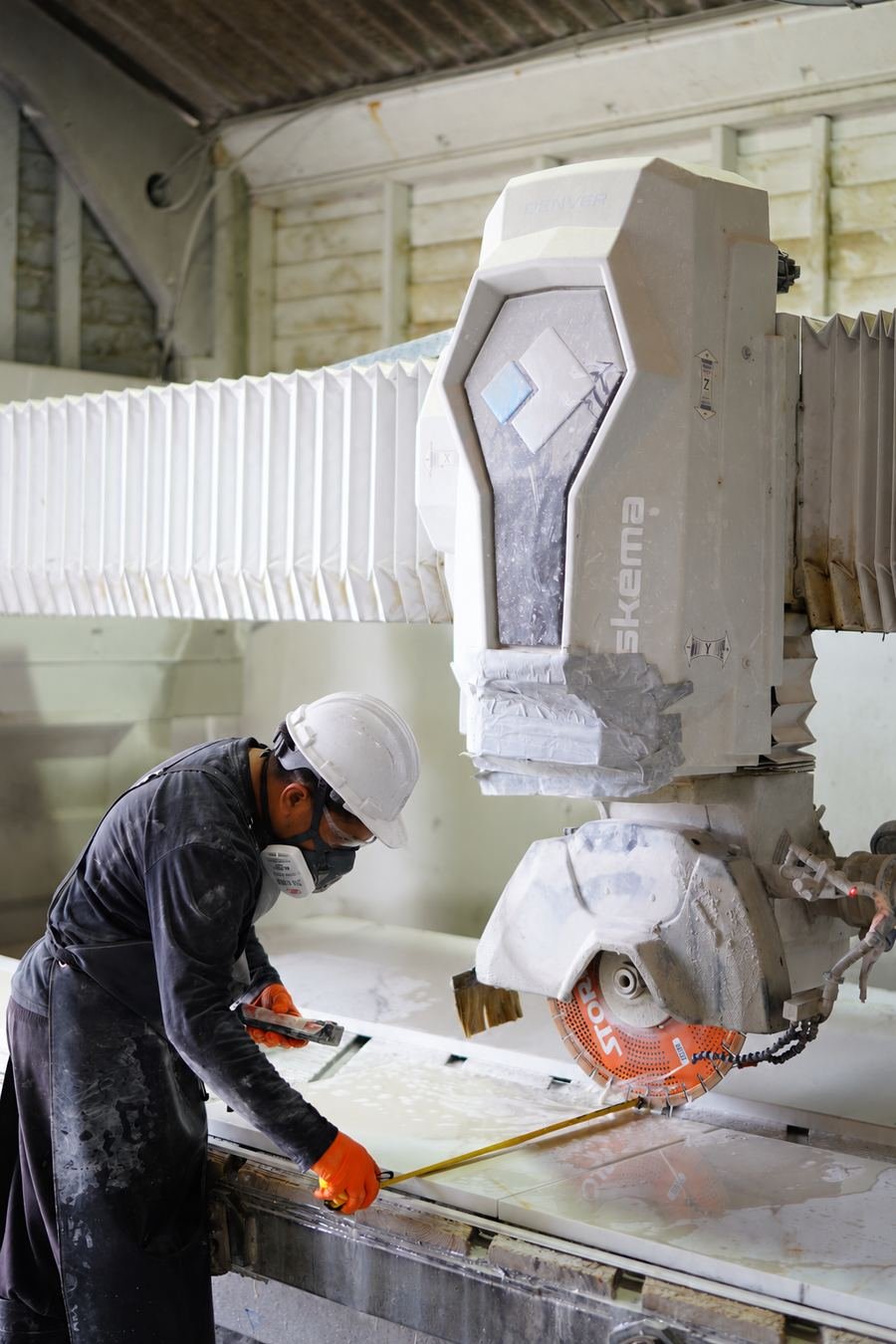 CNC machine cutting a stone worktop